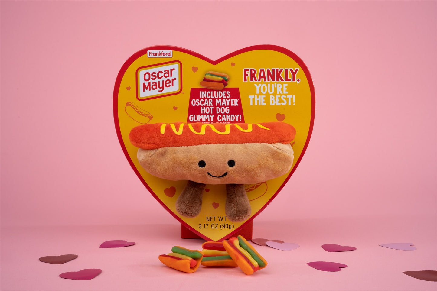 Hot dog heart box with attached hot dog plushy and gummy hot dogs in front 